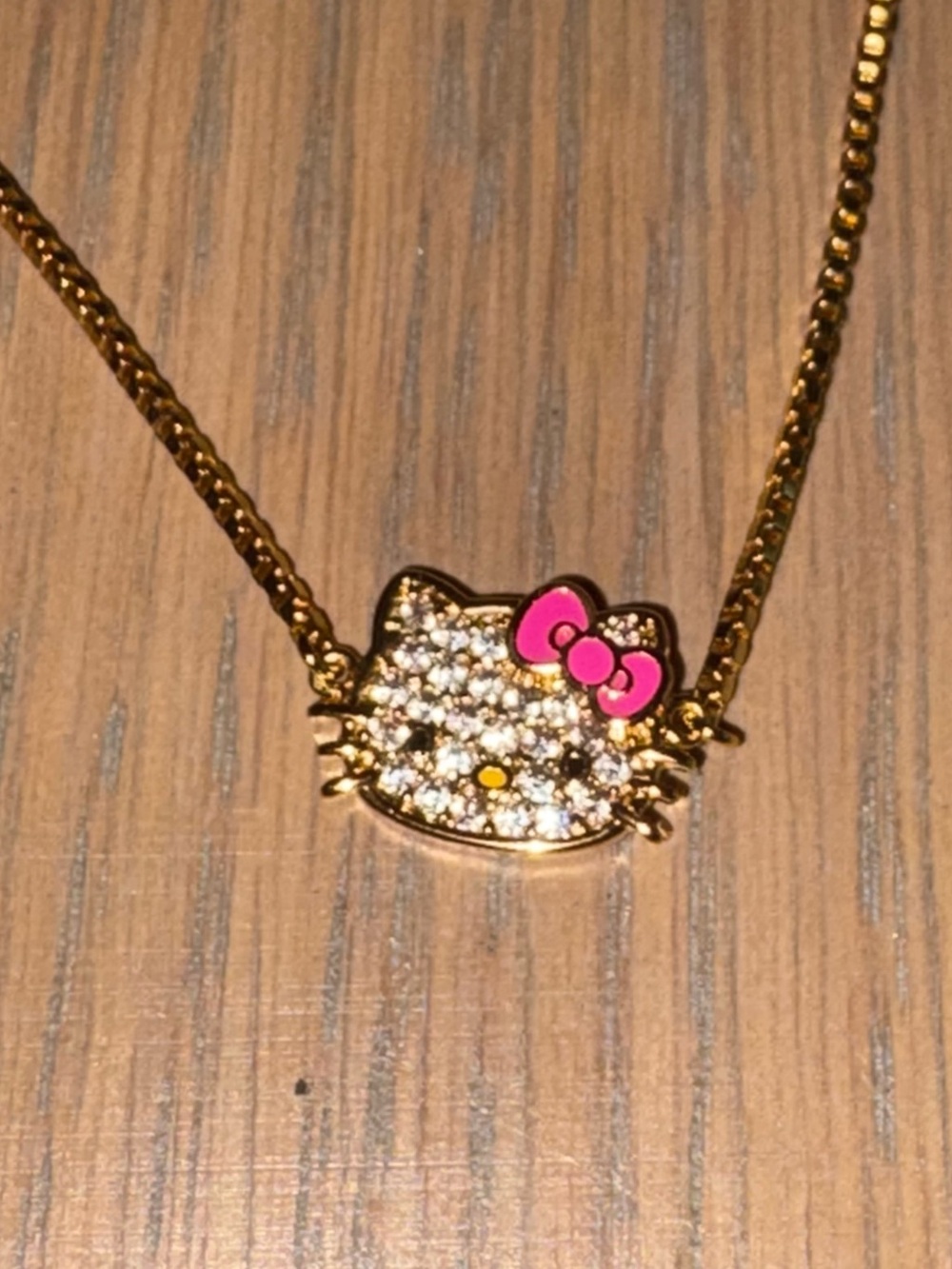 Sanrio Hello Kitty Brass-Tone Crystal Bracelet with Pink Bow — Great Condition